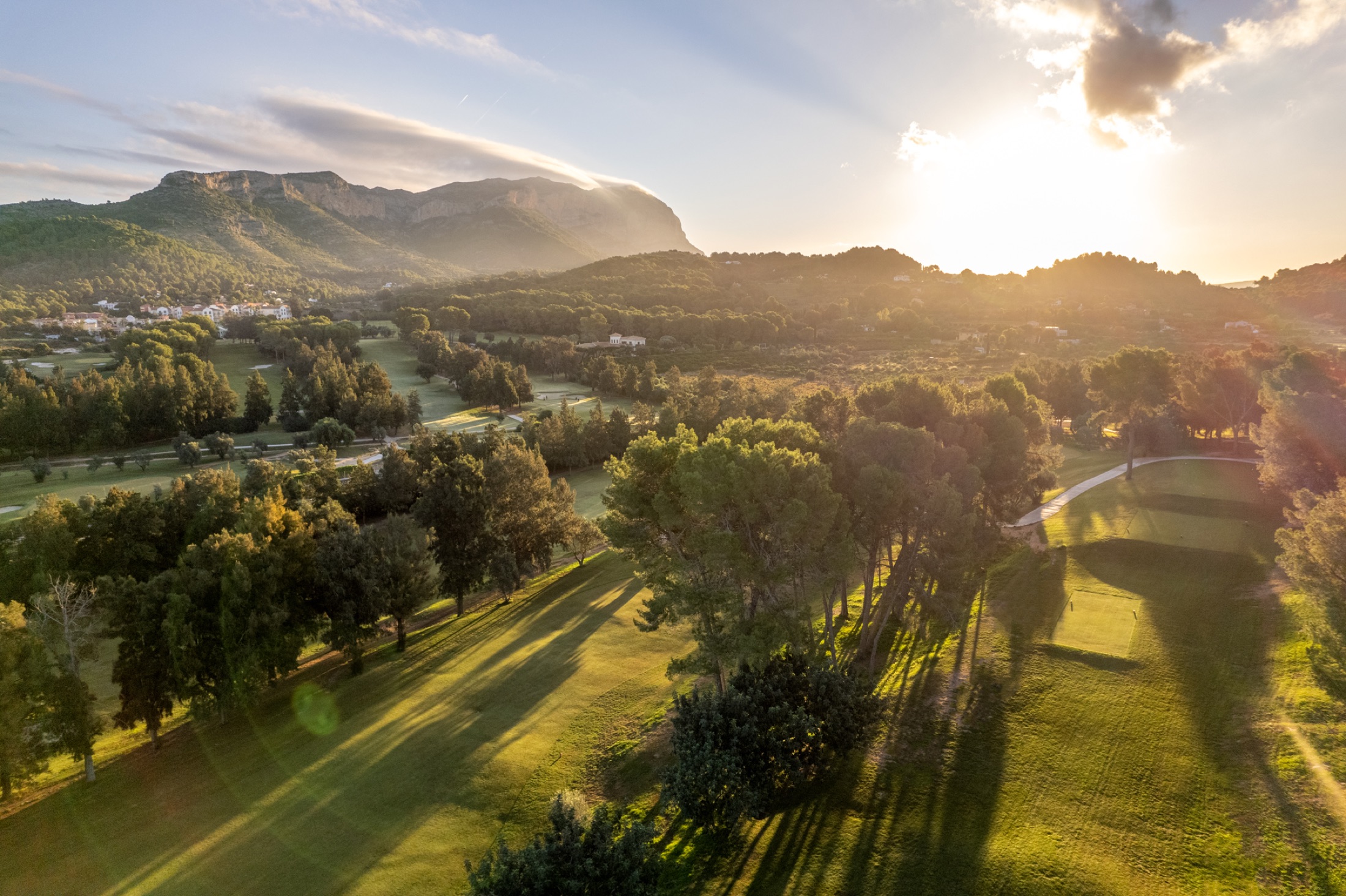 Aerial view across La Sella Golf towards Montgó at sunset